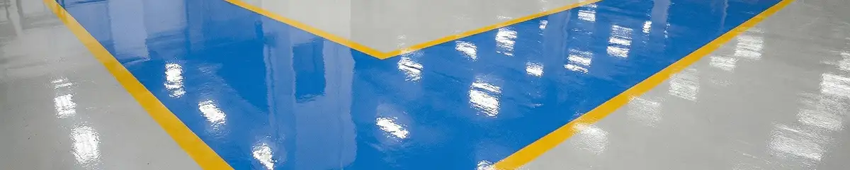 A factory floor professionally covered and marked with epoxy flooring in West Palm Beach, FL