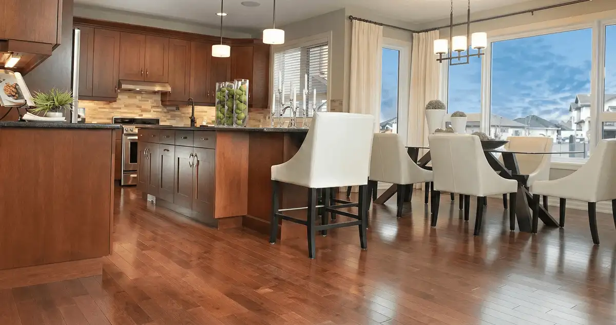 A modern kitchen with professionally installed wood flooring in West Palm Beach, FL