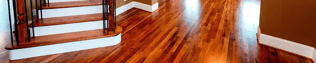 Base floor of a staircase with professionally restored wood flooring in West Palm Beach FL