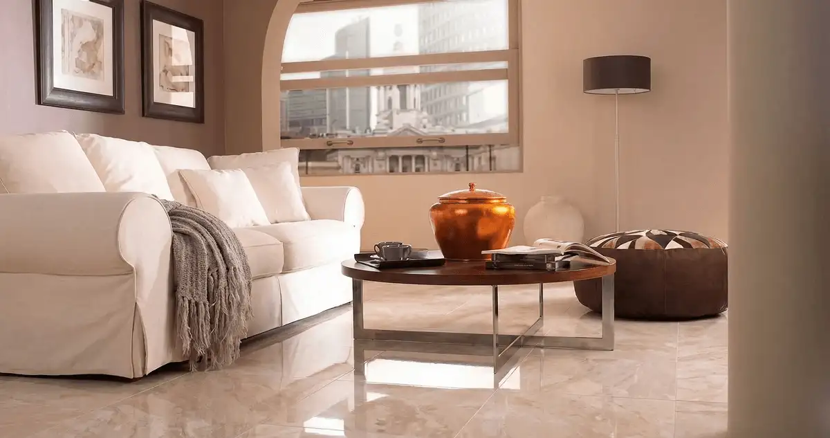 Modern living room with professionally installed marble flooring, a beige sofa, coffee table in West Palm Beach, FL