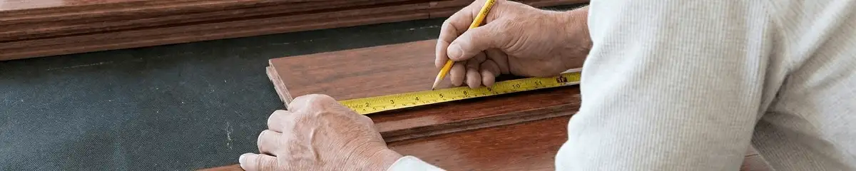 A professional installing wood flooring in West Palm Beach, FL